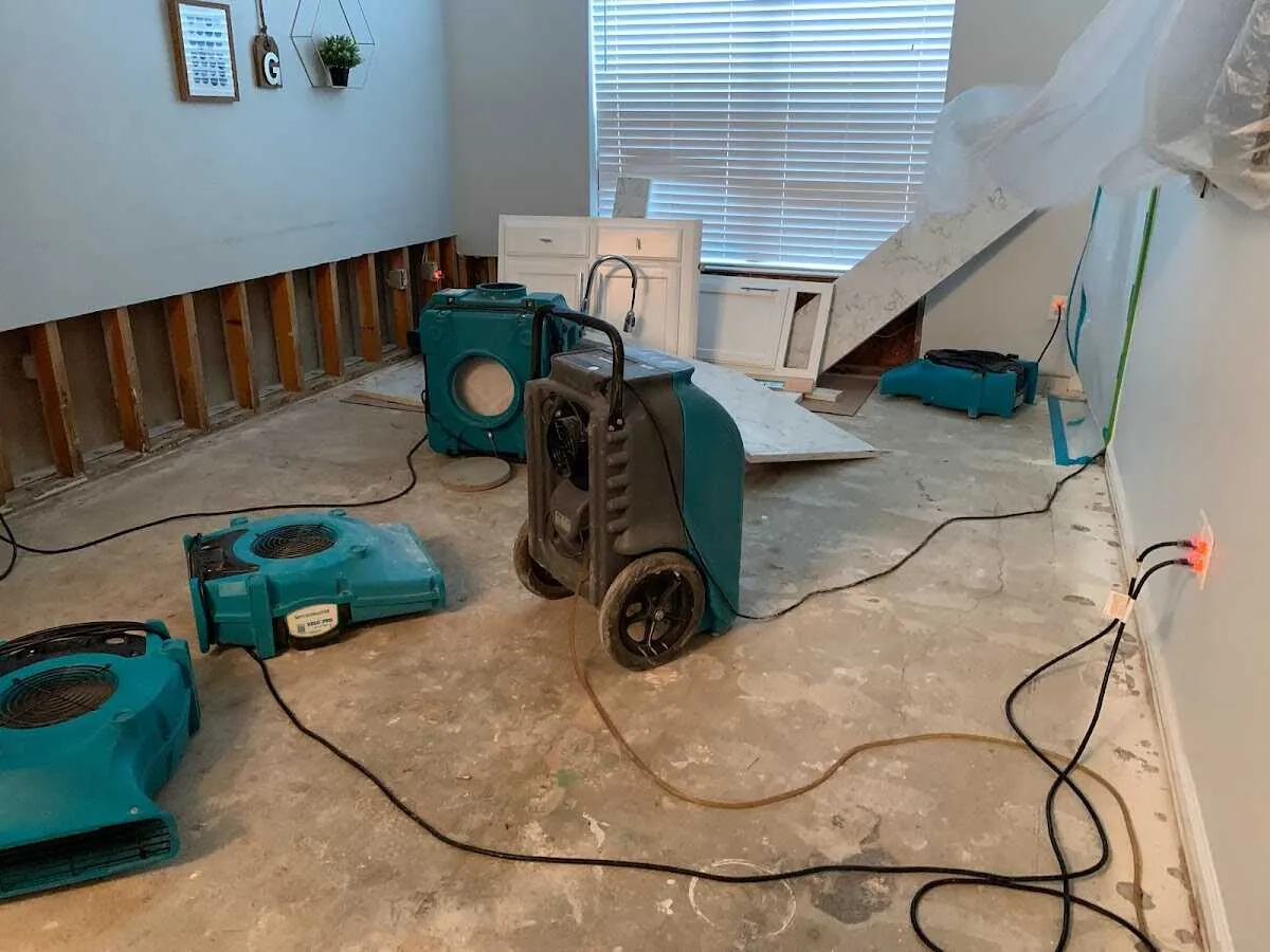 Dehumidifier in flood-cut room for Water Damage Restoration in Oswego